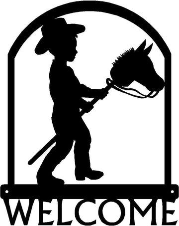Child in Cowboy Attire with Stick Pony/ Hobby Horse- framed in an arch with "Welcome" below- Little Cowboy Western Welcome Sign - The Metal Peddler Cowboy, horse, porch, ranch, Welcome sign, Western
